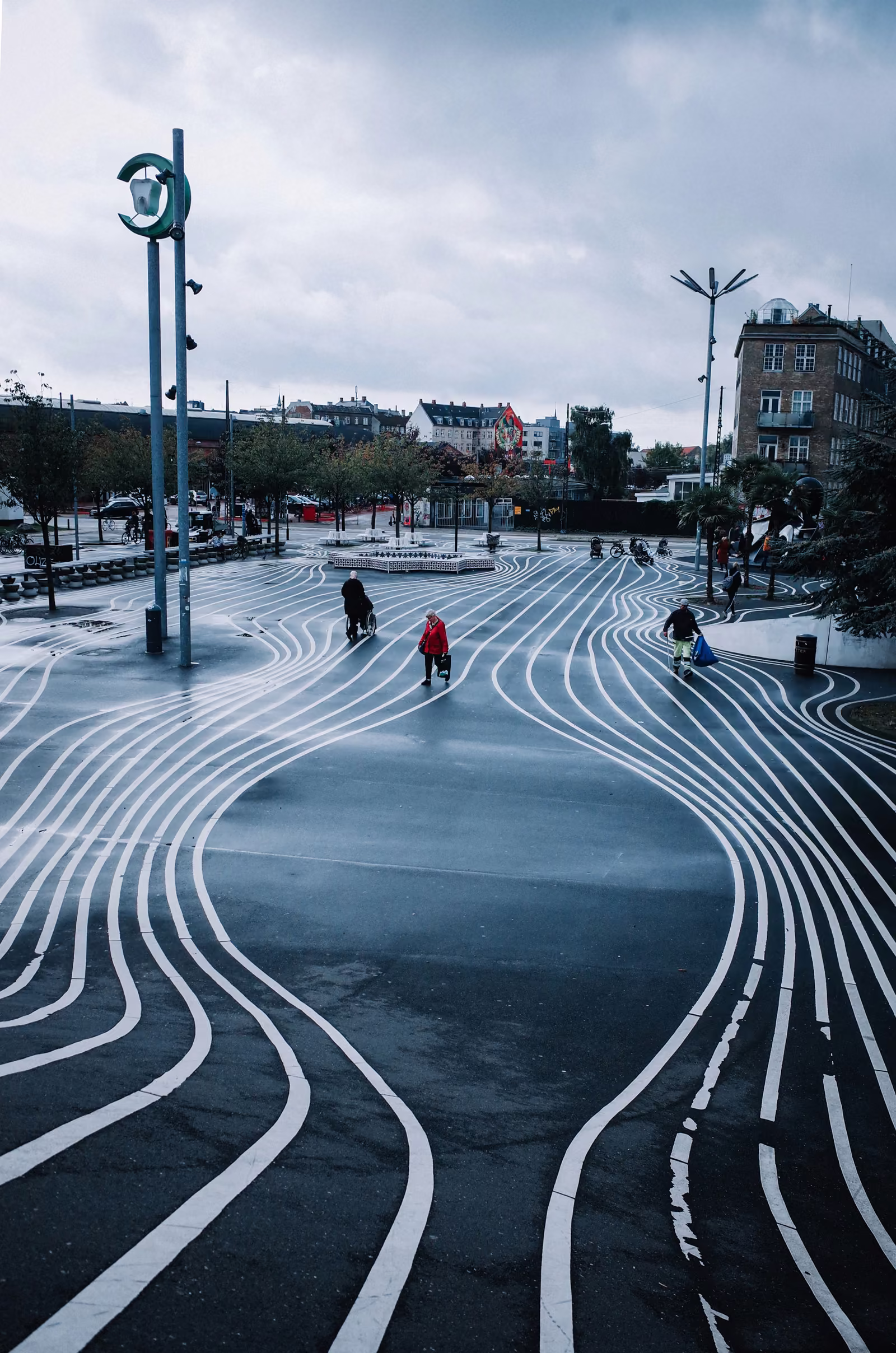 Colorful painted pathway lines in a public plaza, representing distinct, clearly separated network segments.